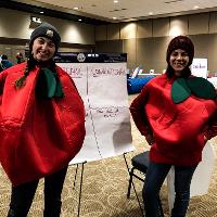 WAFERx graduate students doing outreach by dressing up as fruit and talking to people about their research of diet and health.