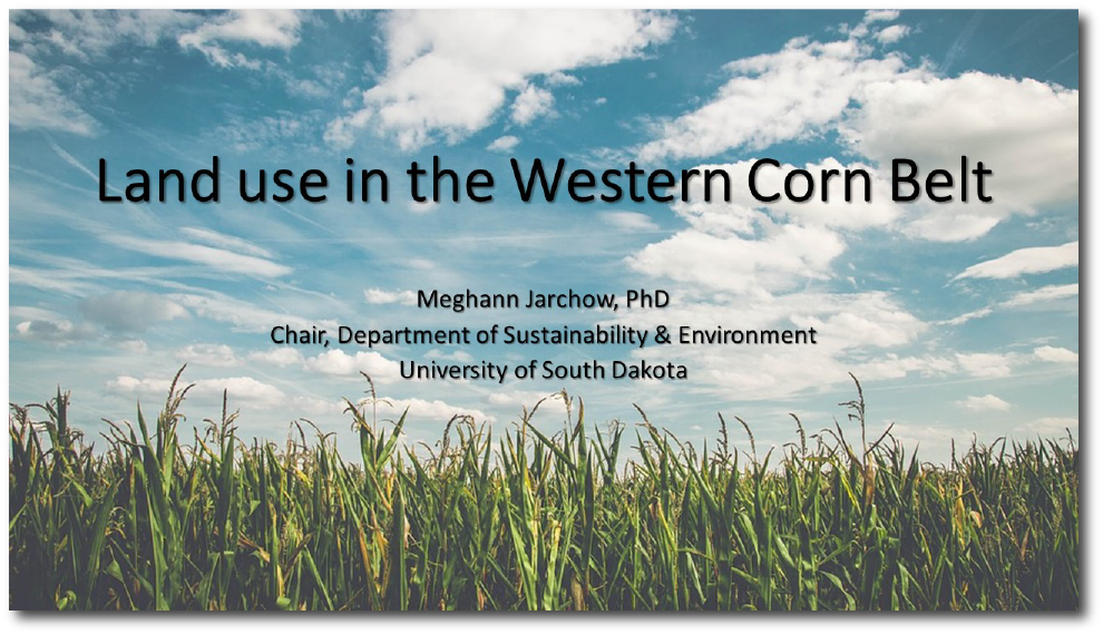 Image of the first slide of the presentation--an image of field of corn with blue sky and clouds in the background