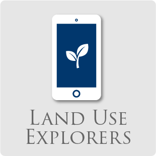 An icon of a phone with a plant on the screen and the words 'Land Use Explorers'